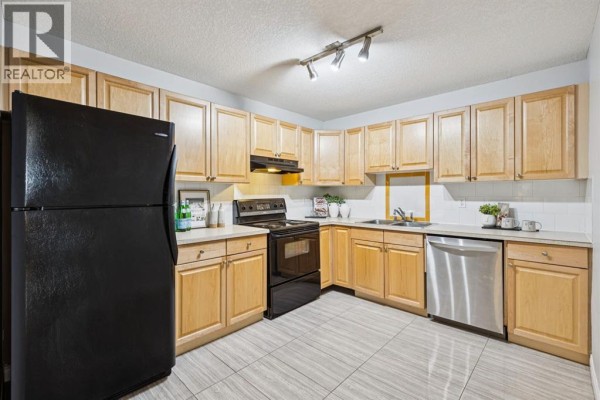 Primary Bedroom - 106, 1528 11 Avenue Sw, Calgary, AB T3C0M9 Photo 5