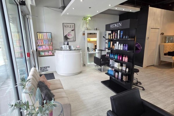 Reception area with product display, seating, and large windows for natural light - 106 - 216 Oak Park Boulevard, Oakville
