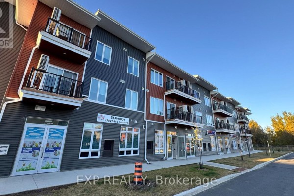 Side view of the building showcasing multiple commercial storefronts and apartment balconies above. - 106 - 3600 Brian Coburn Boulevard, Ottawa