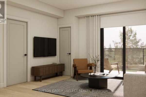 Living area with neutral tones, modern furniture, and a large window with outdoor view. - 107 - 75 Suncoast Drive, Goderich)