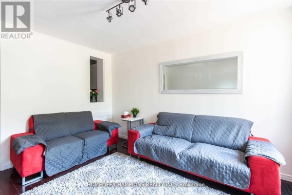 Living room - 106 Lamb Avenue, Toronto, ON M4J4M6 Photo 3