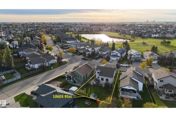 Aerial view of a suburban neighborhood with a house at 10603 95st highlighted. - 10603 95 St, Morinville