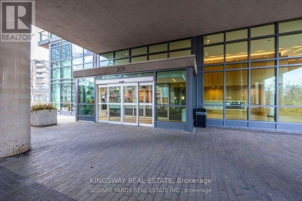 Entrance to the condo building with automatic glass doors and paved walkway. - 1062 - 209 Fort York Boulevard, Toronto