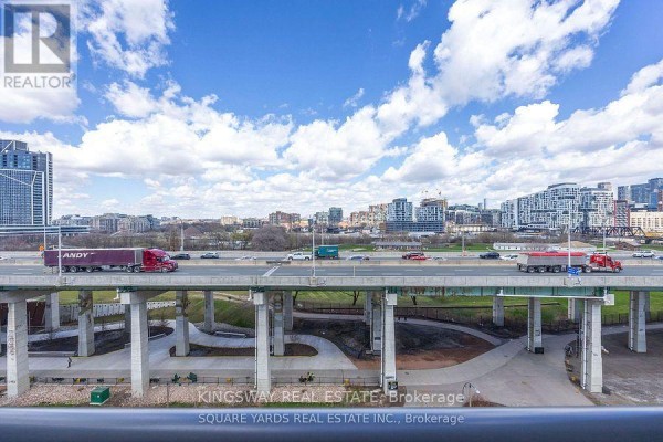 View of the Gardiner Expressway highway with traffic and city skyline beyond. - 1062 - 209 Fort York Boulevard, Toronto