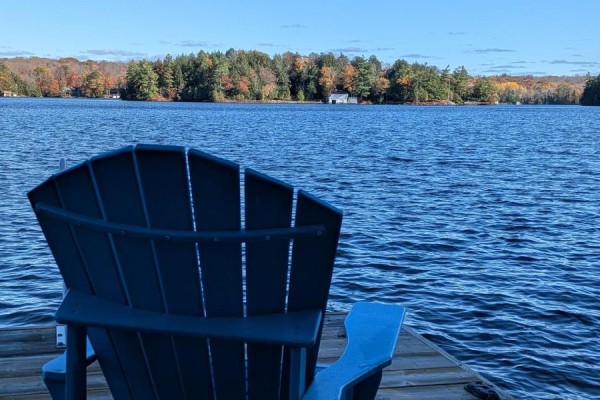 Exterior of a cottage with a sloped roof and lake view - 1063 Whiteside Road, Muskoka Lakes