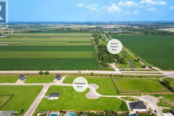 Aerial view of Manhattan Drive housing development surrounded by fields. - 1065 Manhattan Drive, Sarnia