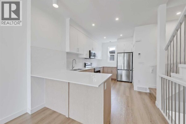Kitchen - 107, 3550 45 Street Sw, Calgary, AB T3E3V2 Photo 2