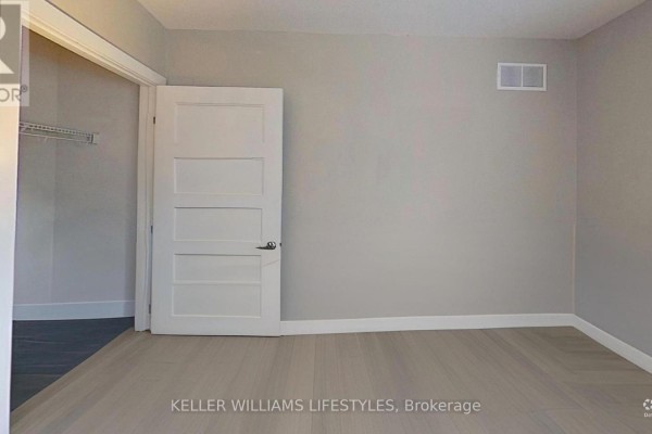 Bedroom with closet and paneled door - 107 Cavendish Crescent London North