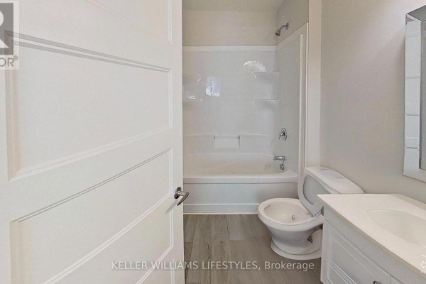 Modern bathroom with bathtub, toilet, and vanity - 107 Cavendish Crescent London North
