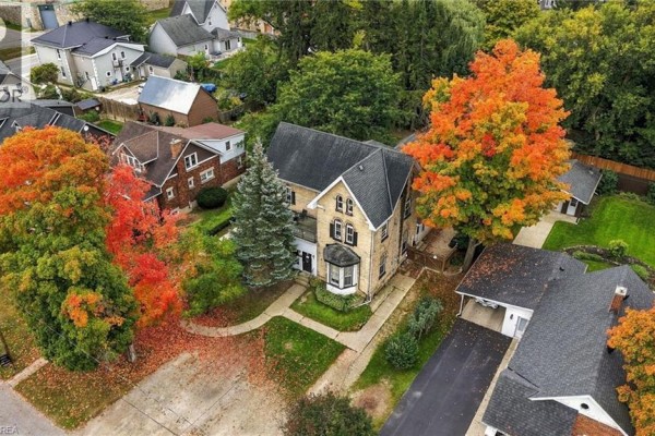 Aerial view of 107 Cayley Street, Brockton, surrounded by colorful autumn trees. - 107 Cayley Street, Brockton