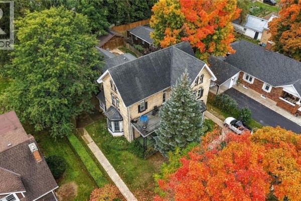 Aerial view of 107 Cayley Street, Brockton, highlighting the home's rear yard and surrounding trees. - 107 Cayley Street, Brockton