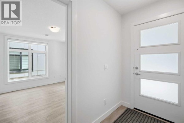 Family room - 108, 8235 8 Avenue Sw, Calgary, AB T3H6H2 Photo 4