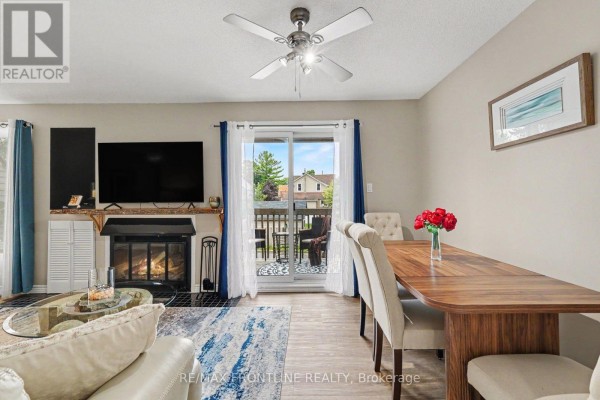 Hallway leading to the kitchen and living room, with a decorative screen divider. - 108 - 24 Townline Road, Carleton Place