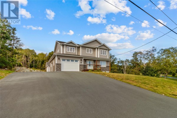 Long asphalt driveway leading to a modern grey two-story house with an attached garage. - 108 Country Drive, Torbay