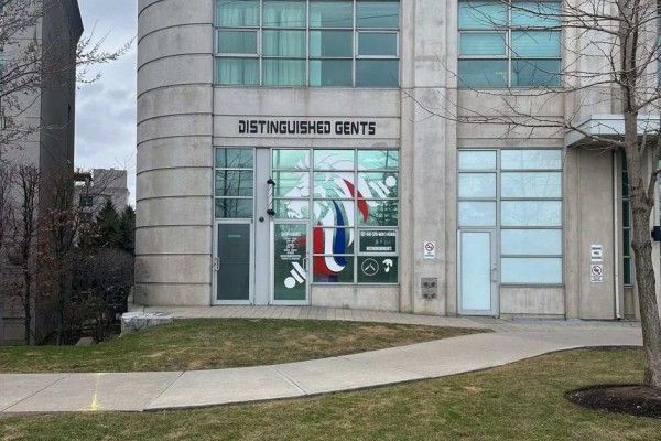Wide view of the barber shop's exterior entrance with a concrete walkway. - 109 - 2067 Lake Shore Boulevard W, Toronto