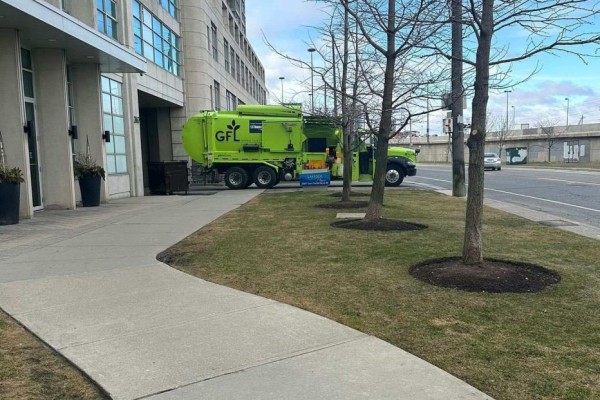 A GFL waste management truck parked on the street in front of the building. - 109 - 2067 Lake Shore Boulevard W, Toronto