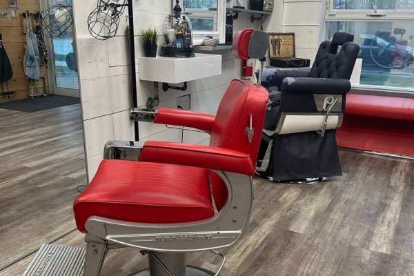 Red leather barber chair and black barber chair inside a salon. - 109 - 2067 Lake Shore Boulevard W, Toronto