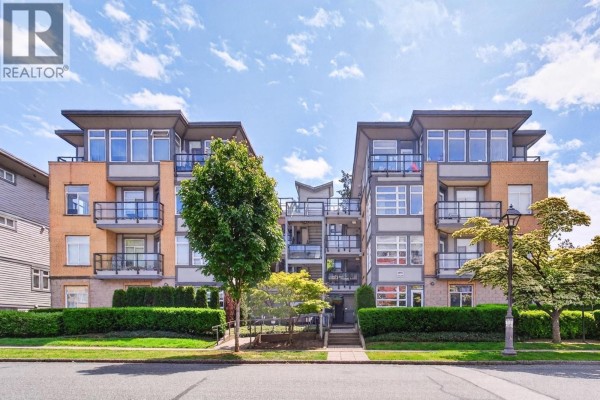 Exterior view of a modern four-story apartment building with balconies and manicured landscaping. - 109 5692 Kings Road, Vancouver