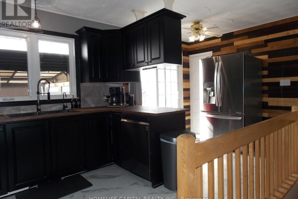 Basement with wood paneling, fireplace, and hardwood floors - 1091 County Rd 15 Road, Alfred And Plantagenet