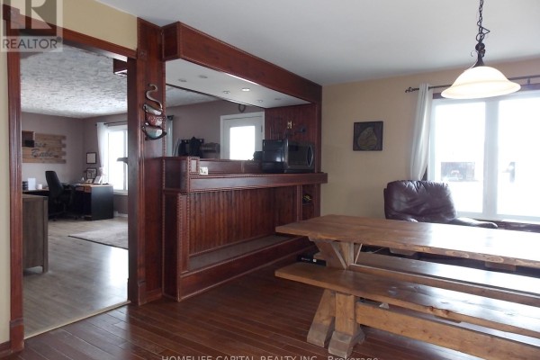Bedroom with bed, desk chair, laminate flooring, and drop ceiling - 1091 County Rd 15 Road, Alfred And Plantagenet