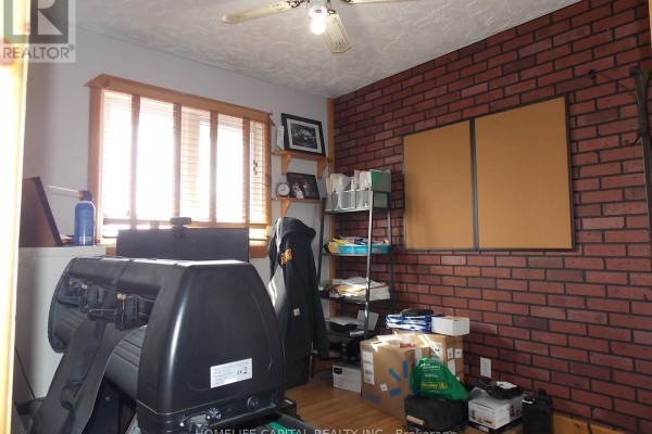 Living room with office area, laminate floors, large windows, stone column - 1091 County Rd 15 Road, Alfred And Plantagenet
