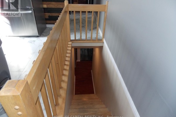 Wooden staircase to lower level, tile floor, stainless steel appliance - 1091 County Rd 15 Road, Alfred And Plantagenet