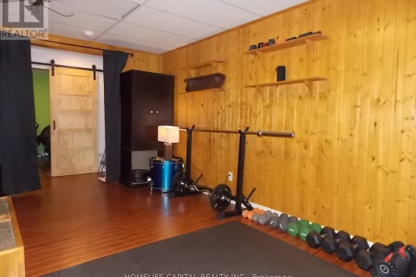 Garage with concrete floor, overhead doors, fluorescent lighting - 1091 County Rd 15 Road, Alfred And Plantagenet