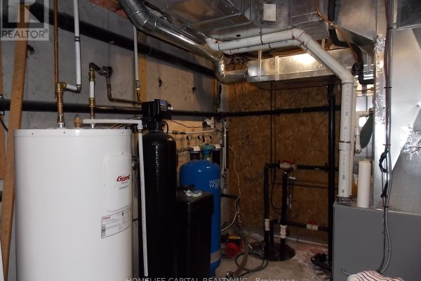 Bedroom with wood accent wall, hardwood floors, window, dresser - 1091 County Rd 15 Road, Alfred And Plantagenet
