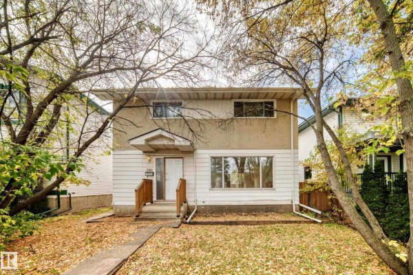 View of the front of the house with a path leading to the entrance. - 10919 69 Av Nw, Edmonton