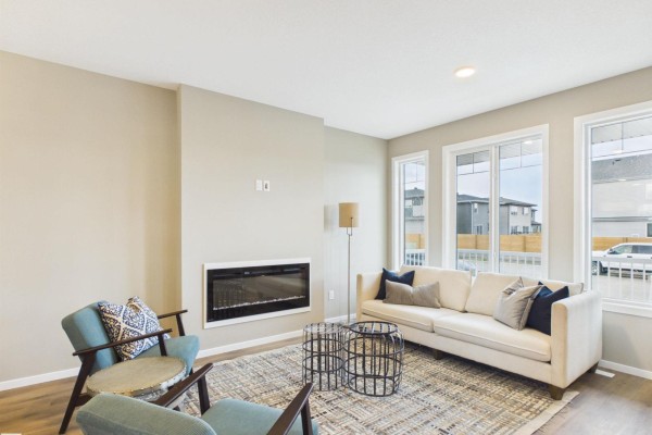 Spacious living area featuring a linear fireplace and open layout - 1098 Mcleod Av, Spruce Grove