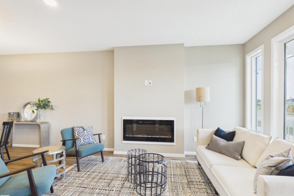 Bright living room with large windows and hardwood flooring - 1098 Mcleod Av, Spruce Grove