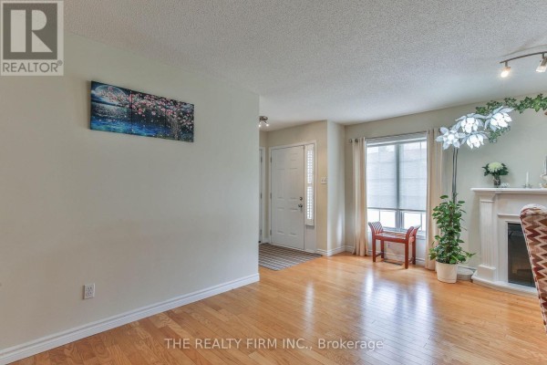 Interior entryway of a townhouse with white doors, hardwood floors, and a large window. - 11 - 100 Stroud Crescent, London South