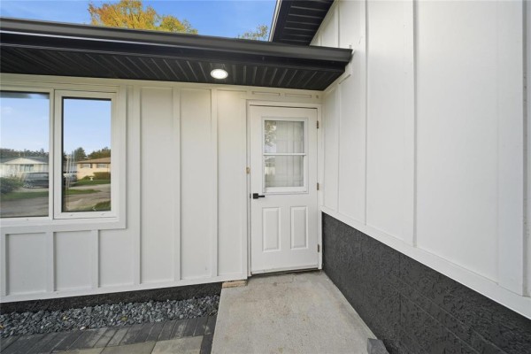 Small bathroom with a white pedestal sink, toilet, and a corner shower stall with glass doors. - 11 Berwyn Bay, Winnipeg
