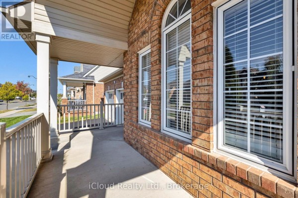 Backyard with wooden deck, grass area, and storage shed - 11 Bonavista Drive, Brampton