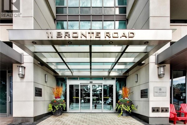 Glass canopy and automatic sliding doors at the 11 Bronte Road condo building entrance. - 11 Bronte Road Unit# 306, Oakville