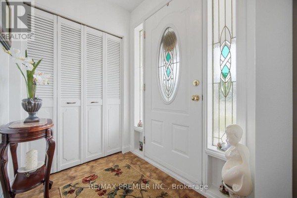 Basement room with a dining table, chairs, hutch, and treadmill. - 11 Kinnie Court, Toronto