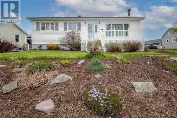 Rear view of the house with a wooden deck and a landscaped garden. - 11 Maclean Street, Sydney Mines