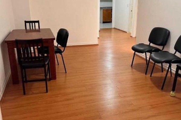 Small dining area with wooden table and black chairs on laminate flooring. - 11 Zeng Cheng Drive, Markham