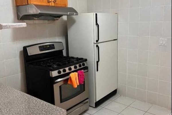 Kitchen featuring gas stove, refrigerator, and tiled backsplash. - 11 Zeng Cheng Drive, Markham
