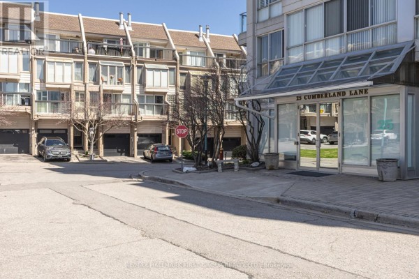 Exterior entrance of the apartment building with glass doors and signage. - 110 - 25 Cumberland Lane, Ajax