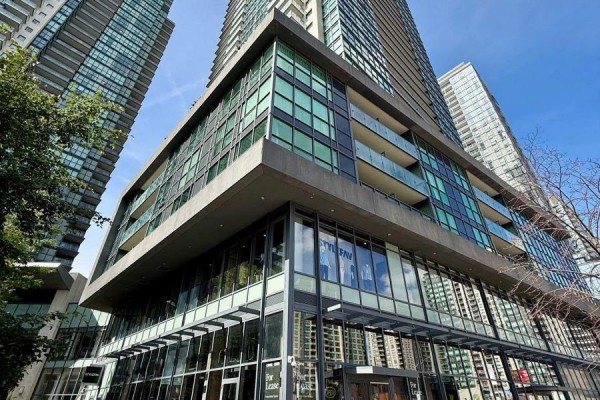 Exterior view of a modern high-rise condo building with glass balconies. - 110 - 5168 Yonge Street, Toronto