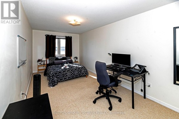Bedroom with bed, desk, computer, and whiteboard - 110 Chartley Private Ottawa
