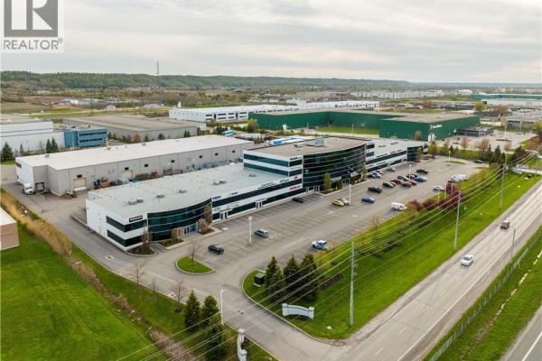 Monument sign for "Hamilton Business Park" at the entrance of the property. - 1100 South Service Road Unit# 116-216, Stoney Creek