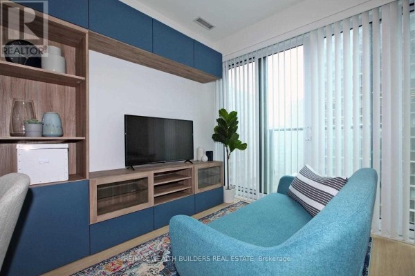 Interior view of living area with sofa, entertainment unit, and vertical blinds on window. - 1108 - 7 Grenville Street, Toronto
