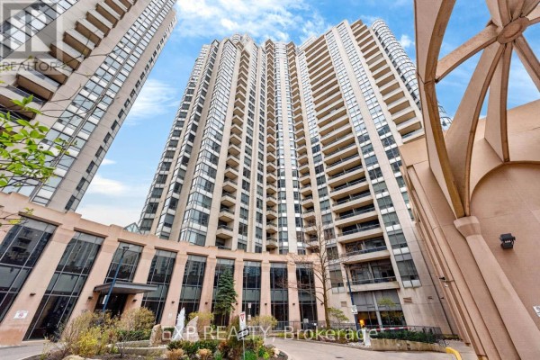 A wide shot of the exterior of a tall apartment building with balconies. - 1109 - 5 Northtown Way, Toronto