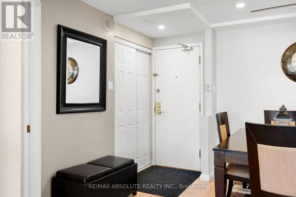 Mailbox area with many metal boxes, bulletin board, and trash bins. - 1109 - 80 Sandcastle Drive, Ottawa