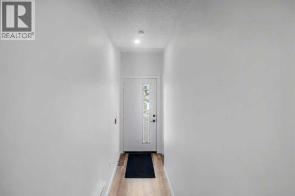 Bedroom - 111, 156 Park Street, Cochrane, AB T4C3H3 Photo 3