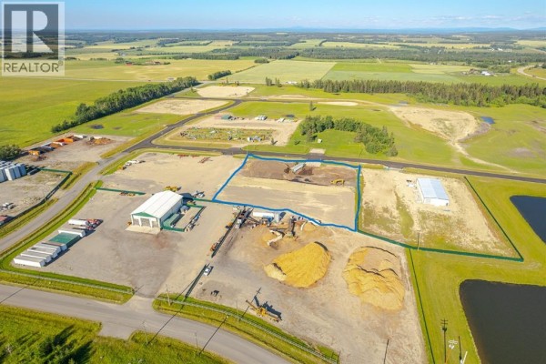 Aerial view with blue outline highlighting a section of an industrial lot with construction activity. - 111, 32532 Range Road 42, Rural Mountain View County