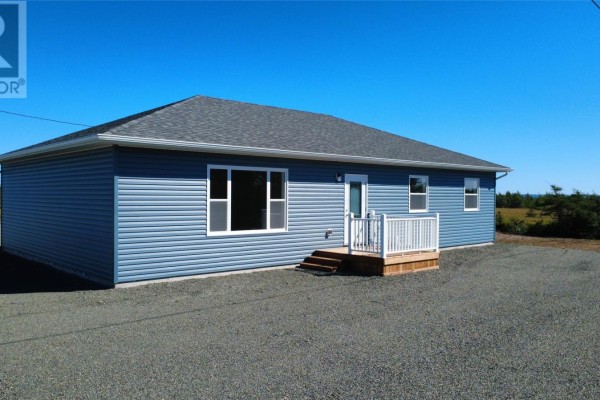 Blue sided house with white trim windows, a white railing deck, and wooden steps. - 111-113 Branch Hill Road, Winterland