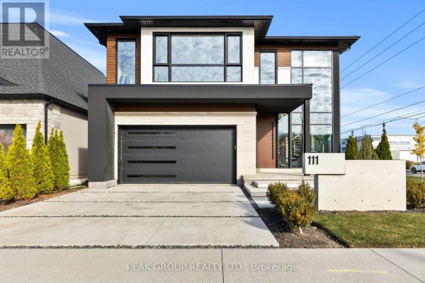 Modern living room with marble fireplace and wine display - 111 Millpond Road Niagara On The Lake